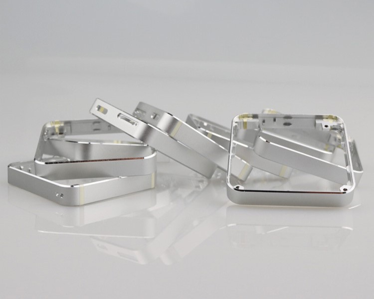 Machined metal enclosure frames showing edges and mounting features