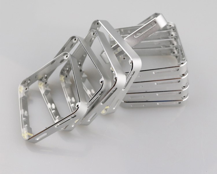 Small batch of machined metal enclosure frames
